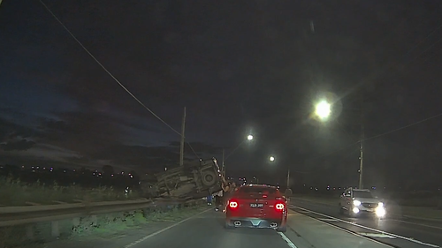 The couple pulled over to help the occupant of the car, who was seen on CCTV stumbling out of the boot of the car, surrounded by a group of people who had also stopped to help.