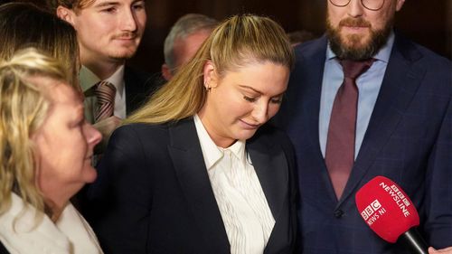 Nikita Hand, who is also known as Nikita Ni Laimhin, speaks with the media outside the High Court in Dublin.