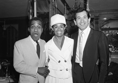 Entertainers Trini Lopez (right), Barbara McNair (center) and Sammy Davis, Jr. (left) pose for a portrait at a party at Shepheard's Nightclub in the Drake Hotel, 1964 (Getty)