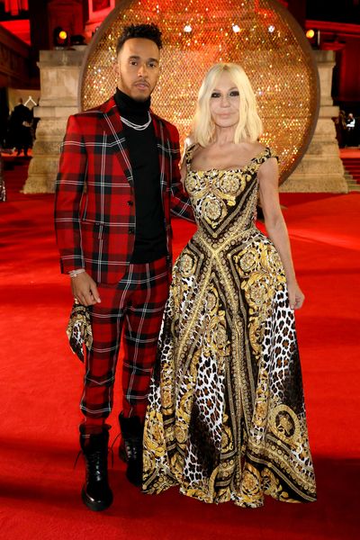 Lewis Hamilton and Donatella Versace in Versace at the Fashion Awards, London.&nbsp;