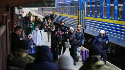 People fleeing the conflict from neighboring Ukraine arrive to Przemysl train station in Przemysl, Poland.