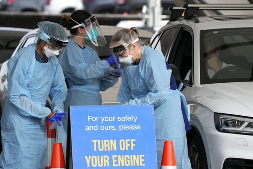 Staff prepare to collect samples at a drive-through COVID-19 testing clinic at Bondi Beach in Sydney, Australia.