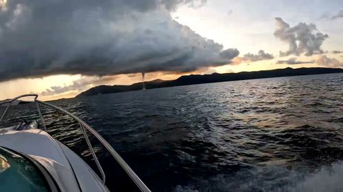 A group of fisherman have stumbled across a waterspout while on a day out in Whitsundays.﻿