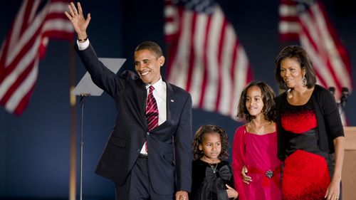 President elect Barack Obama, his daughters Sasha (in black) and Malia (in pink) and his wife Michele on the stage of his election night victory party in Chicago's Grant Park, 2008