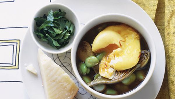 Broad bean and artichoke hotpot with saffron eggs