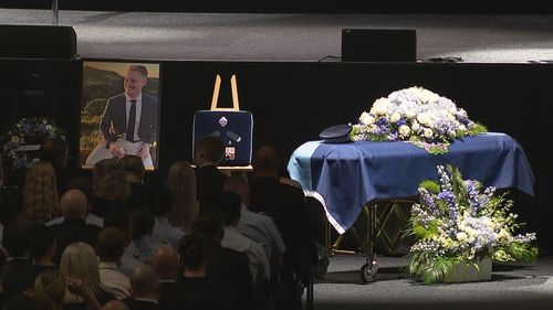 Coffins of Constable Matthew Arnold and Rachel McCrow at the public memorial.