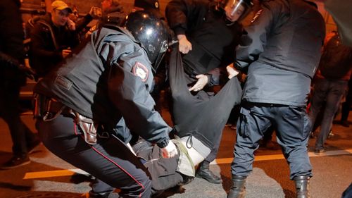 A protest in Putin's hometown was disbanded  after demonstrators blocked traffic and attempted to break through police cordons. (AP)