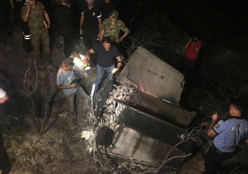 Soldiers of the Turkish army and northern Cypriot forces inspect the site where a missile allegedly fired from Syria landed overnight in the Turkish occupied north village of Tashkent.