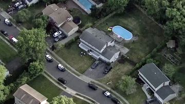 An aerial photo of the house and pool where the bodies were found.