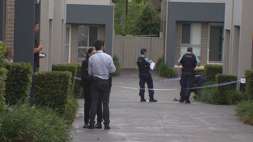 Police have launched a major search for three men who allegedly stormed into a home in Sydney's west and shot a 26-year-old man in the leg.