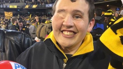 Tyler- a massive fan of the Richmond Tigers- has taken the news of his new diagnosis on "the chin", his mother said. (Twitter via Brad Fishlock)