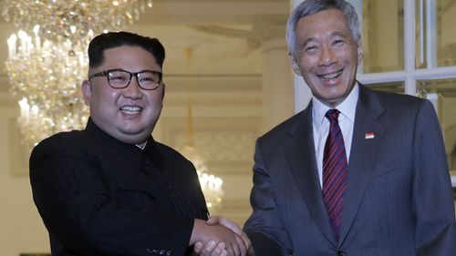 North Korean leader Kim Jong Un meets with Singapore's Prime Minister Lee Hsien Loong at the Istana or presidential palace.