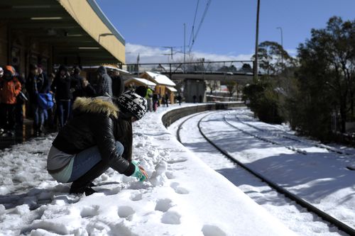 Snow has covered parts of New South Wales overnight, causing major road closures as wild weather continues across the state.