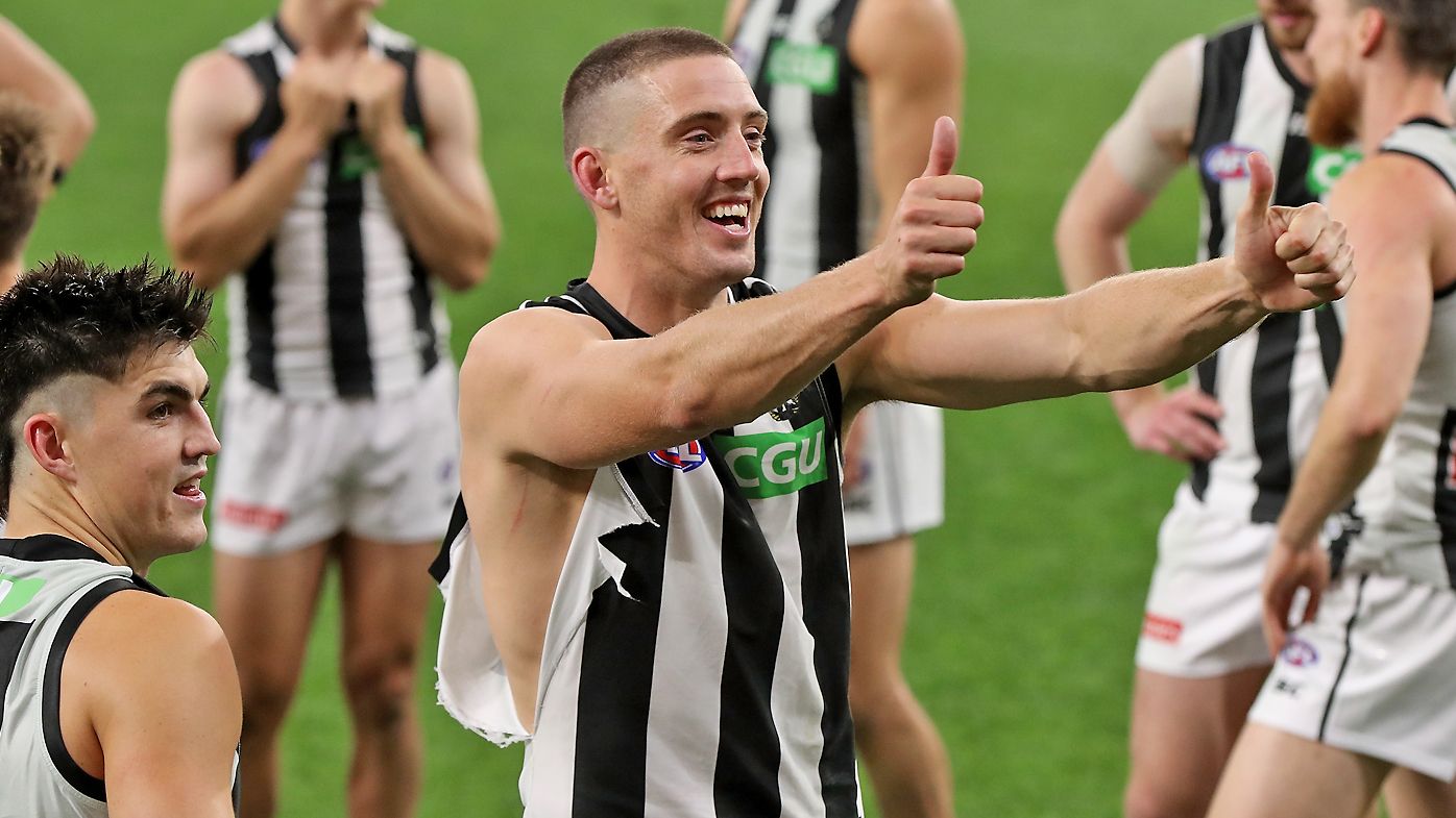 Darcy Cameron of the Magpies acknowledges supporters after winning
