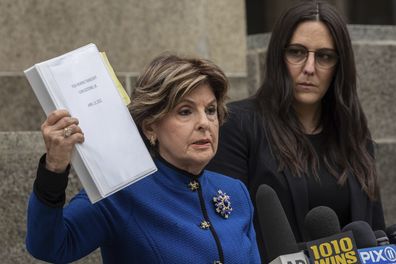 Kelsey Harbert, right, sexual assault victim of Cuba Gooding Jr., listens as her lawyer Gloria Allred, left, speaks during a press conference outside Manhattan Criminal Court, Thursday, Oct 13, 2022, in New York. 