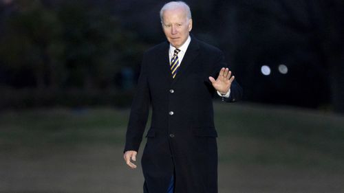 President Joe Biden walks across the South Lawn of the White House in Washington, DC.