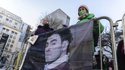 Luigi Mangione supporters stand outside the Supreme Court on Friday, Feb. 21, 2025 in New York. (AP Photo/Stefan Jeremiah)