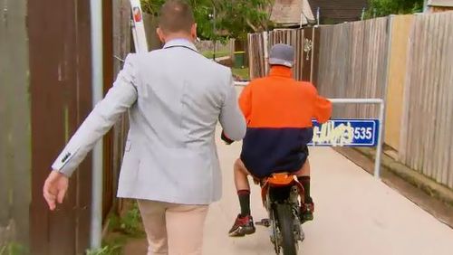A Current Affair reporter Steve Marshall tries to track down one of the riders. (9NEWS)