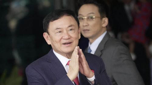 FILE - Thailand's former Prime Minister Thaksin Shinawatra, arrives at Don Muang airport in Bangkok, Thailand, Tuesday, Aug. 22, 2023. Thai prosecutors on Wednesday, May 29, 2024, said Thaksin will be indicted for defaming the monarchy, three months after he was freed on parole on other charges. (AP Photo/Sakchai Lalit, File)