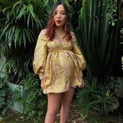 Dami Im shows off her baby bump in 2022.