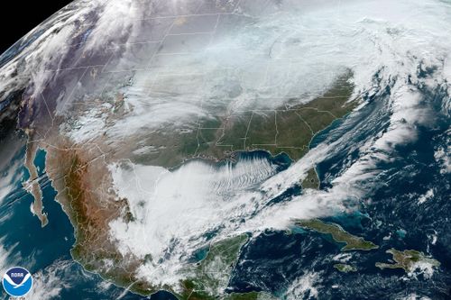 This satellite image made available by NOAA shows weather systems across North America on Dec. 23, 2022, at 10:56 a.m. EST. Tens of millions of Americans endured bone-chilling temperatures, blizzard conditions, power outages and canceled holiday gatherings Friday from a winter storm that forecasters said was nearly unprecedented in its scope, exposing about 60% of the U.S. population to some sort of winter weather advisory or warning. (NOAA via AP)