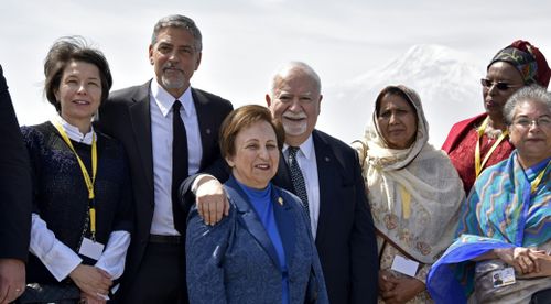 Aurora Prize co-founders, Selection Committee members, finalists, including Hollywood star and rights advocate George Clooney and guests pose in front of Mount Ararat while visiting the Genocide Memorial. (AFP)