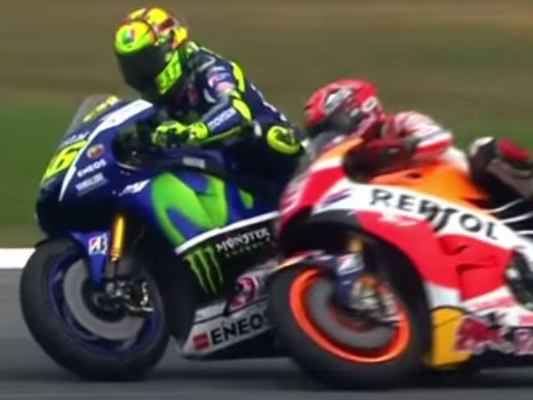 Valentino Rossi (L) battles with Marc Marquez. (Supplied)