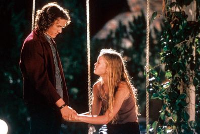 Heath Ledger and Julia Stiles at swing in a scene from the film '10 Things I Hate About You', 1999. (Photo by Buena Vista/Getty Images)
