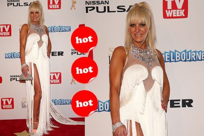 It's way too easy to take potshots at Brynne, but considering her past track record, this is a rather conservative outfit. Brynne, keep on bedazzling us with your wacky red carpet fashions!