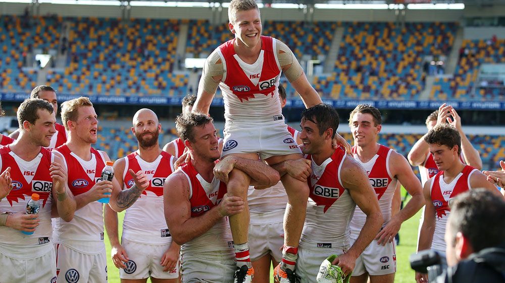 Swans hold off gallant Lions in AFL