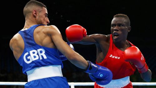  Galal Yafai of Great Britain (left) competes against Simplice Fotsala of Cameroon in their men's light fly 46-49kg preliminary bout. (Getty)
