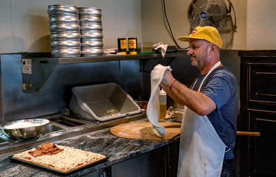 Chef Giovanni Fabiano from Rosa's Pizza, Brooklyn making a Vegemite Pizza for the 'secret menu'.