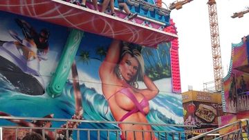 This mural bikini babe at the Ekka was covered up after complaints.