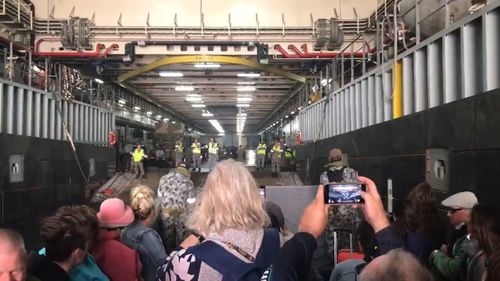 First evacuees board Navy ship off the coast of Mallacoota.