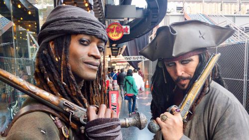 Mr Ansalvish, who is dressed as "Pirates of the Caribbean" character Jack Sparrow, is part of a bevy of costumed characters who wanders the boulevard. (9NEWS/Ehsan Knopf)