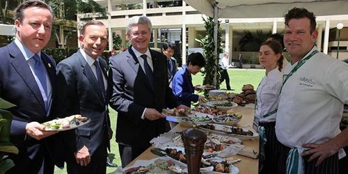 David Cameron, Tony Abbott and Stephen Harper enjoy the buffet at the G20 Leaders' Retreat. (9NEWS)