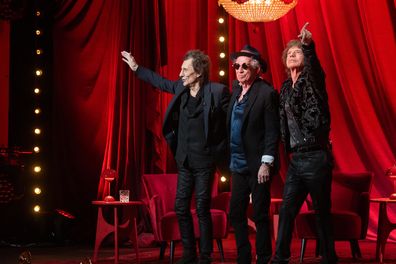 Ronnie Wood, Keith Richards and Mick Jagger of Rolling Stones pose on stage during Rolling Stones Hackney Diamonds album launch event on September 6, 2023 in London 