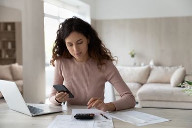 Woman budgeting and paying bills
