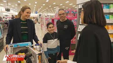 A Current Affair host Ally Langdon with Nicky and Simon Tadros at Big  W.