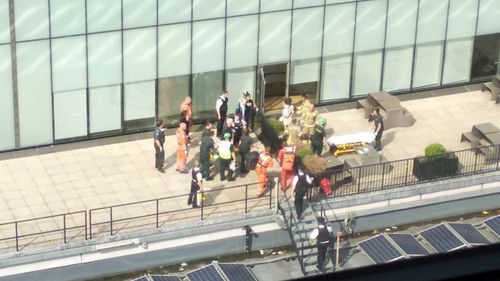 Emergency crews attend a scene at the Tate Modern art gallery, following the arrest of a 17-year-old on suspicion of attempted murder after a six-year-old boy was thrown from the 10th-floor observation deck.