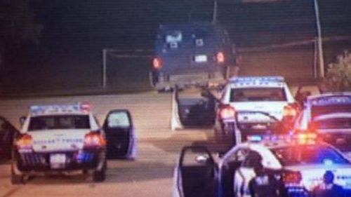 Texan police surround the gunman's vehicle. (Supplied, Twitter)