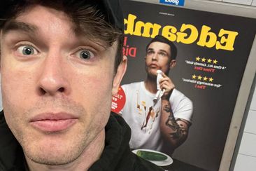 UK comedian Ed Gamble in front of his changed poster