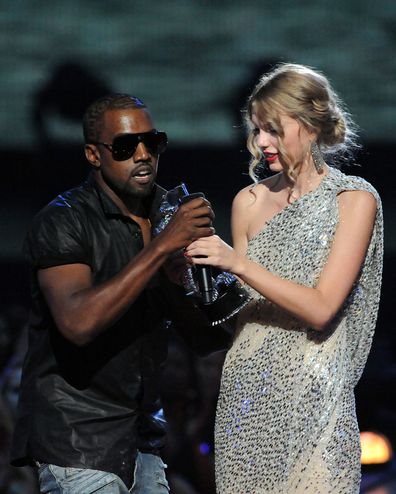 Kanye West jumps onstage as Taylor Swift accepts her award for the "Best Female Video" award during the 2009 MTV Video Music Awards at Radio City Music Hall on September 13, 2009 in New York City. 