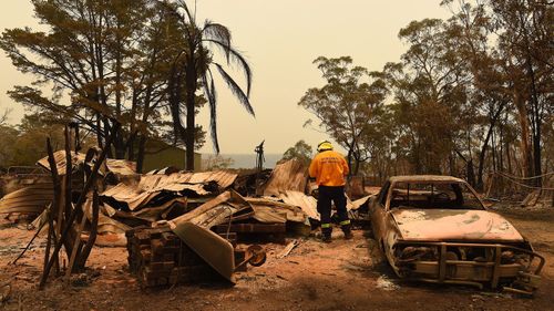 Adam Small from the RFS inspects some of the damage in Balmoral.