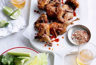 Fried quail with cucumber wedges