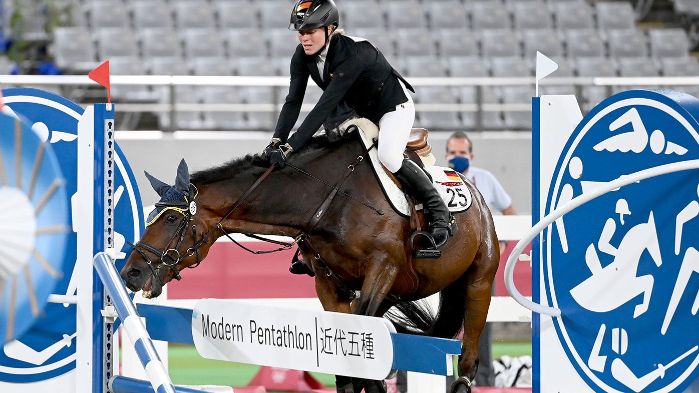 The horse Saint Boy of Annika Schleu from Germany refuses to jump in the Modern Pentathlon at the Tokyo Olympics.