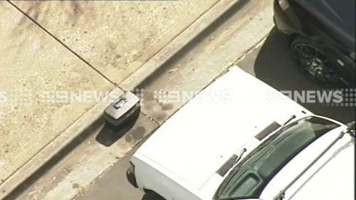 Police were called to the scene of the suspicious case just after 11am. (9NEWS)