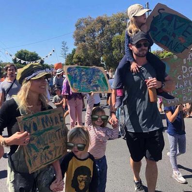 Chris Hemsworth and his kids protest climate change in Byron Bay.