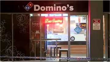 Police are investigating after a man held up an Edensor Park Domino's overnight.