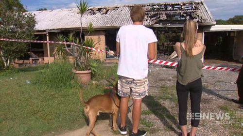 Dan Brewster and Kaela Chenery at the scene of the fire this morning. (9NEWS)